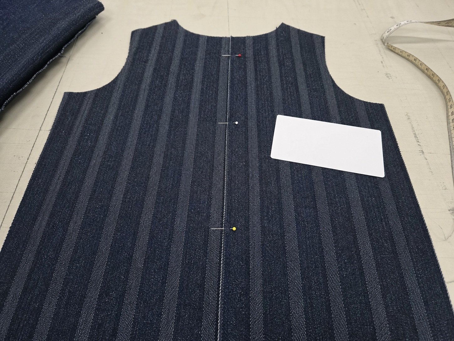 Vertical stripe jacquard denim cutting direction seam matching and garment panel quality control